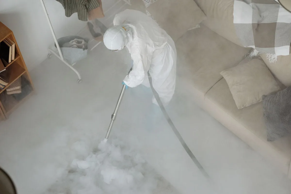 Biohazard cleanup technician in protective equipment, Rosemead, CA